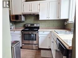 Kitchen with range, dishwasher, refridgerator - 