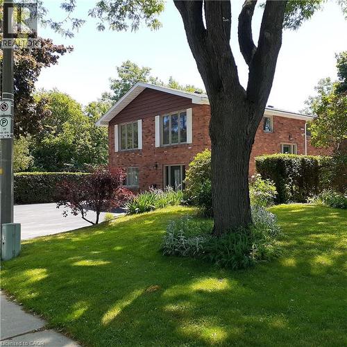 Brick exterior with white trim windows and a brown gable accent - 3 San Pedro Drive, Hamilton, ON - Outdoor