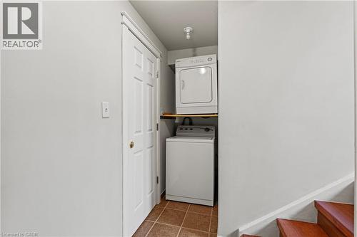 Dedicated laundry area with stacked white washer and dryer units - 3 San Pedro Drive, Hamilton, ON - Indoor Photo Showing Laundry Room