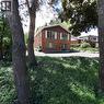 Brick exterior with white window shutters and a dark green entry door - 3 San Pedro Drive, Hamilton, ON  - Outdoor 