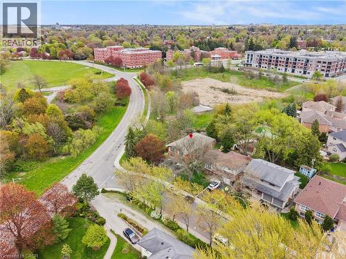 Residential property featuring a red brick exterior and a grey shingle roof - 3 San Pedro Drive, Hamilton, ON - Outdoor With View