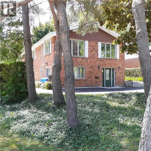 Brick exterior featuring contrasting brown siding and white trim - 3 San Pedro Drive, Hamilton, ON - Outdoor
