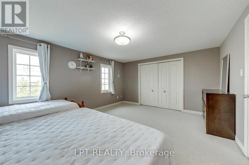 Double closet in Primary Bedroom - 6 - 10 Fallowfield Drive, Kitchener, ON - Indoor Photo Showing Bedroom