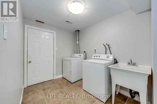 specious laundry room with access to cold room - 6 - 10 Fallowfield Drive, Kitchener, ON - Indoor Photo Showing Laundry Room