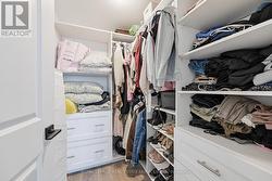 Walk-In Closet with Custom Built-Ins - 