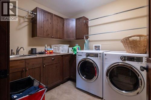 upstairs laundry - 30 Silver Ridge Drive, Fernie, BC - Indoor Photo Showing Laundry Room
