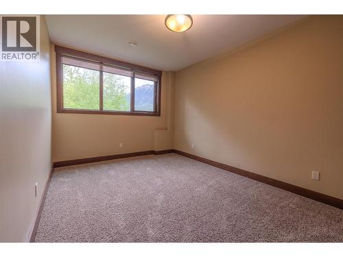basement bedroom ground level - 30 Silver Ridge Drive, Fernie, BC - Indoor Photo Showing Other Room