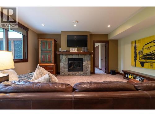basement rec room gas fireplace - 30 Silver Ridge Drive, Fernie, BC - Indoor Photo Showing Living Room With Fireplace