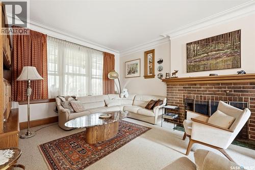 203 Angus Crescent, Regina, SK - Indoor Photo Showing Living Room With Fireplace
