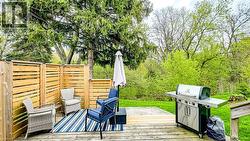 Expansive wood deck with natural wood privacy fencing - 