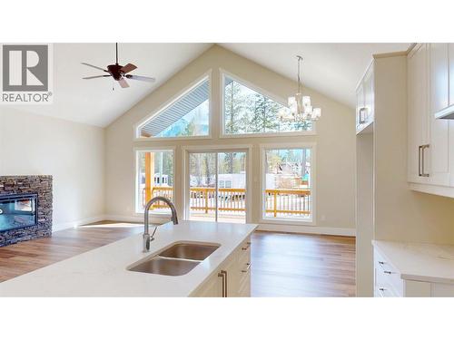 4868 Riverview Drive Unit# 118, Edgewater, BC - Indoor Photo Showing Kitchen With Fireplace With Double Sink