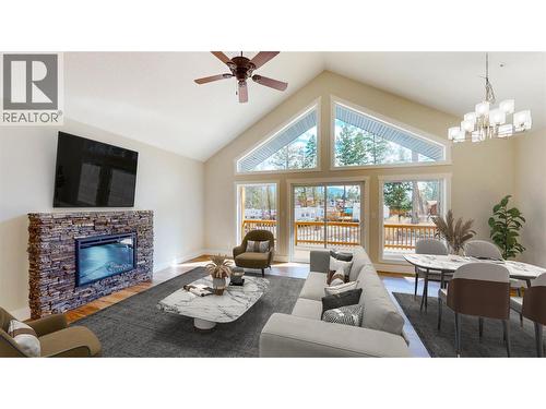 Virtually staged. Please note elements in this photograph including furniture and furnishngs have been virtually staged to demonstrate potential design ideas. - 4868 Riverview Drive Unit# 118, Edgewater, BC - Indoor Photo Showing Living Room With Fireplace