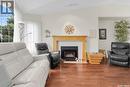 1 135 Pinehouse Drive, Saskatoon, SK  - Indoor Photo Showing Living Room With Fireplace 