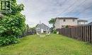 Expansive green lawn with a wood privacy fence - 43 Adair Avenue S, Hamilton, ON  - Outdoor 