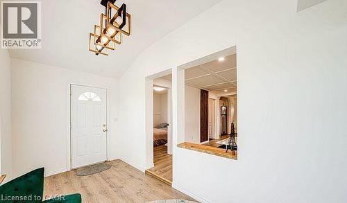 Entryway featuring a vaulted ceiling and wood-finish flooring - 43 Adair Avenue S, Hamilton, ON - Indoor Photo Showing Other Room
