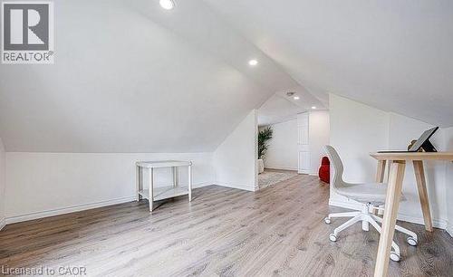 Sloped ceilings with recessed lighting define this versatile space - 43 Adair Avenue S, Hamilton, ON - Indoor