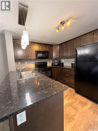 511 210 Rajput Way, Saskatoon, SK - Indoor Photo Showing Kitchen With Double Sink