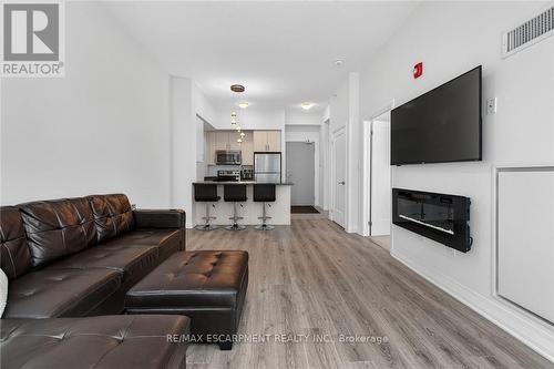 516 - 10 Concord Place, Grimsby, ON - Indoor Photo Showing Living Room With Fireplace
