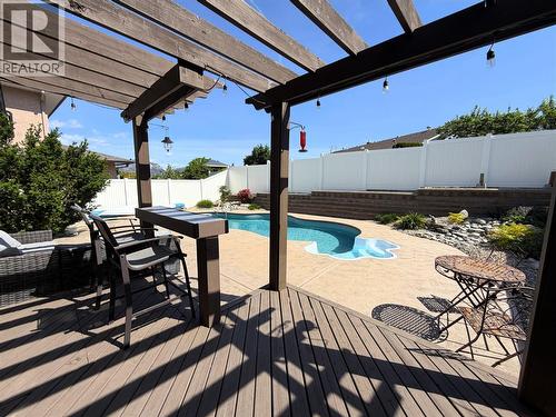Summer photo - back deck and pool - 6925 Chardonnay Place, Oliver, BC - Outdoor With In Ground Pool With Deck Patio Veranda