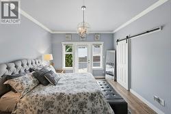 Primary bedroom with walk-in closet: main floor - 