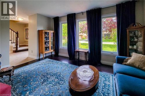 Hardwood-finish flooring throughout, complemented by a broad area rug - 49 Ashwood Drive, Cambridge, ON - Indoor
