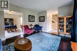 Dark wood-finish flooring complements light wall tones - 