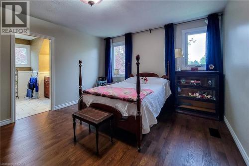 Hardwood-finish flooring throughout the room with neutral wall tones - 49 Ashwood Drive, Cambridge, ON - Indoor Photo Showing Bedroom