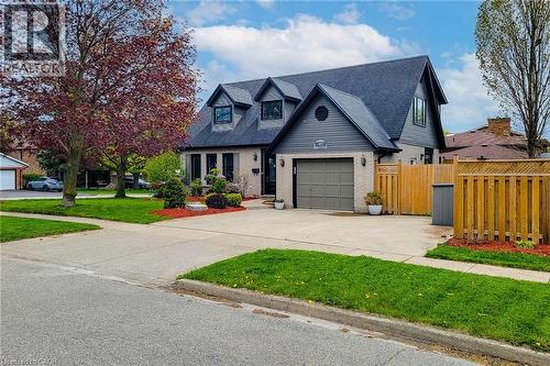 Brick and siding exterior featuring a prominent gabled roofline and dormer windows - 49 Ashwood Drive, Cambridge, ON - Outdoor With Facade