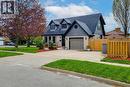 Brick and siding exterior featuring a prominent gabled roofline and dormer windows - 49 Ashwood Drive, Cambridge, ON  - Outdoor With Facade 