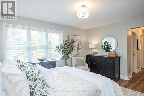 Large windows overlooking trees in backyard - 23 Baggs Crescent, Cambridge, ON - Indoor Photo Showing Bedroom