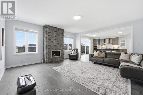 643 Rye Grass Way, Ottawa, ON - Indoor Photo Showing Living Room With Fireplace