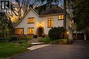 Stucco exterior with stone detailing and a contrasting dark roof - 3081 Balmoral Avenue, Burlington, ON  - Outdoor 