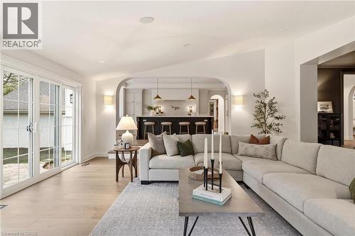 Spacious living area featuring light wood-finish flooring and white walls - 3081 Balmoral Avenue, Burlington, ON - Indoor Photo Showing Living Room