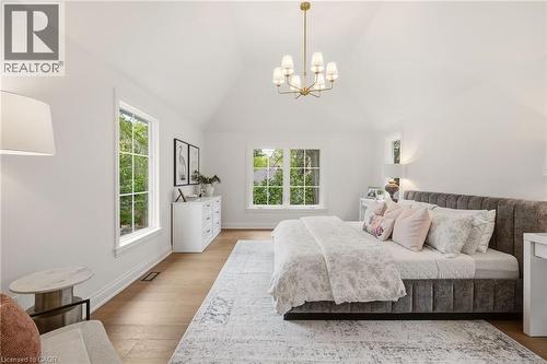 Vaulted ceiling featuring a brass chandelier - 3081 Balmoral Avenue, Burlington, ON - Indoor Photo Showing Bedroom
