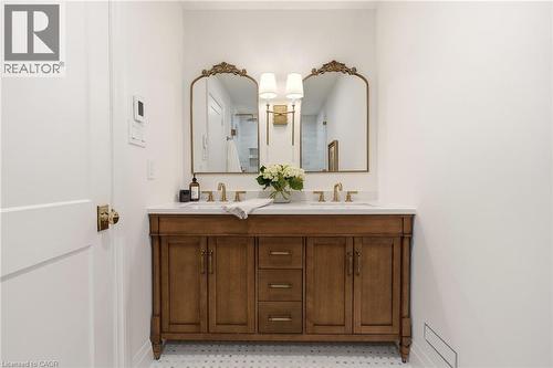 Double vanity with a white countertop and brass-finish hardware - 3081 Balmoral Avenue, Burlington, ON - Indoor Photo Showing Bathroom