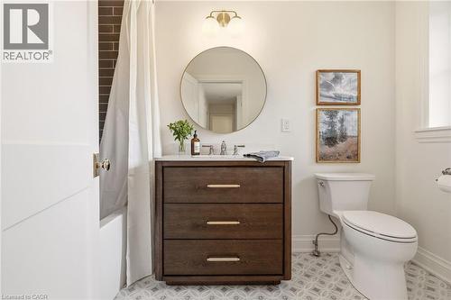 Bathroom featuring a dark wood-finish vanity with a white countertop and rectangular undermount sink - 3081 Balmoral Avenue, Burlington, ON - Indoor Photo Showing Bathroom