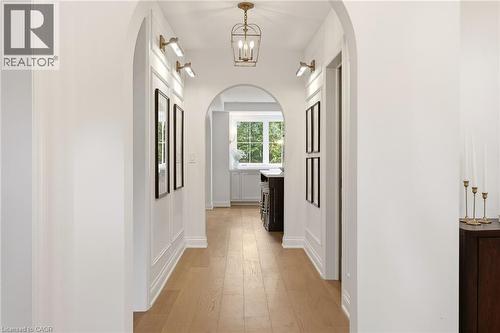 Hallway featuring archways, wood-finish flooring, wainscoting, and recessed wall lighting - 3081 Balmoral Avenue, Burlington, ON - Indoor Photo Showing Other Room