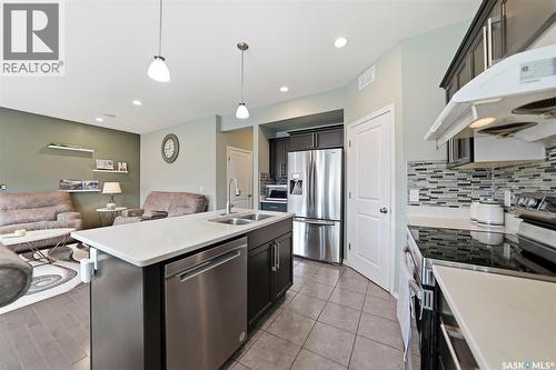 519 Rempel Manor, Saskatoon, SK - Indoor Photo Showing Kitchen With Stainless Steel Kitchen With Double Sink With Upgraded Kitchen