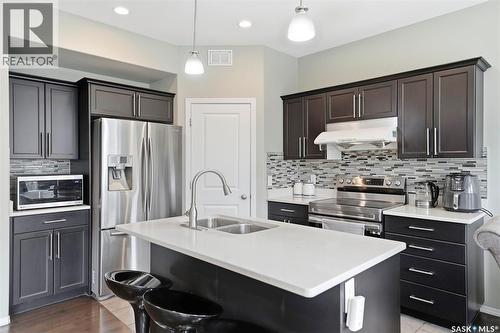 519 Rempel Manor, Saskatoon, SK - Indoor Photo Showing Kitchen With Stainless Steel Kitchen With Double Sink With Upgraded Kitchen