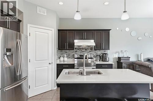 519 Rempel Manor, Saskatoon, SK - Indoor Photo Showing Kitchen With Stainless Steel Kitchen With Double Sink With Upgraded Kitchen