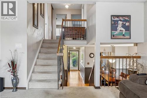 Split-level entry with carpeted staircase and hardwood flooring - 21 Lionshead Lookout, Brampton, ON - Indoor Photo Showing Other Room