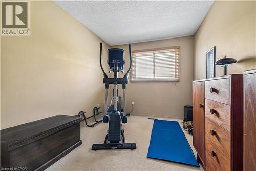 Carpeted room with a window featuring horizontal blinds - 21 Lionshead Lookout, Brampton, ON - Indoor Photo Showing Gym Room
