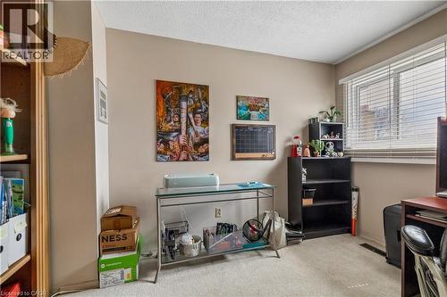Neutral wall paint, ceiling texture, and light-tone carpet flooring define this interior space - 21 Lionshead Lookout, Brampton, ON - Indoor