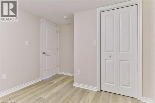 Interior space featuring light wood-finish flooring, white baseboards, and neutral wall paint - 38 Dunkirk Drive Unit# B, Hamilton, ON - Indoor Photo Showing Other Room