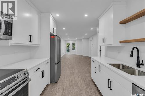 320 25Th Street W, Saskatoon, SK - Indoor Photo Showing Kitchen With Stainless Steel Kitchen With Double Sink With Upgraded Kitchen