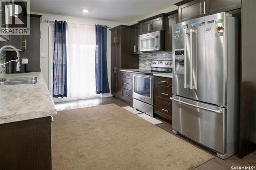 205 Reddekopp Lane, Warman, SK - Indoor Photo Showing Kitchen With Double Sink