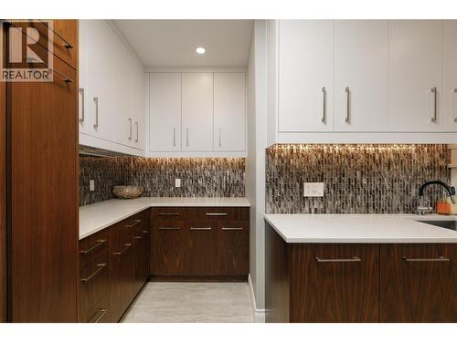 Laundry Room Custom Cabinetry - 228 Caliburn Court, Kelowna, BC - Indoor Photo Showing Kitchen