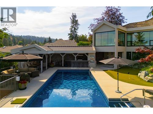 Outdoor Living - 228 Caliburn Court, Kelowna, BC - Outdoor With In Ground Pool With Deck Patio Veranda