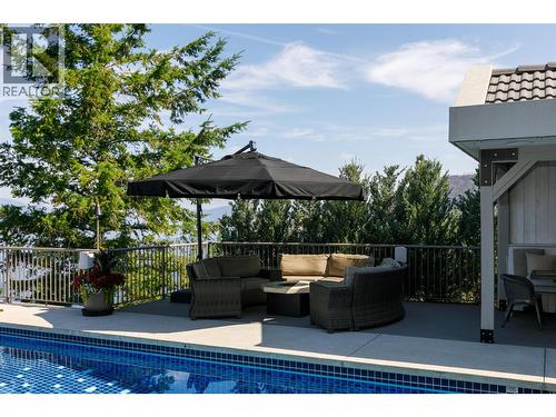 Fire Table Sitting Area Poolside - 228 Caliburn Court, Kelowna, BC - Outdoor With In Ground Pool With Deck Patio Veranda
