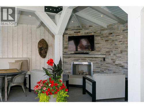 TV, Outdoor gas fireplace - 228 Caliburn Court, Kelowna, BC -  With Fireplace